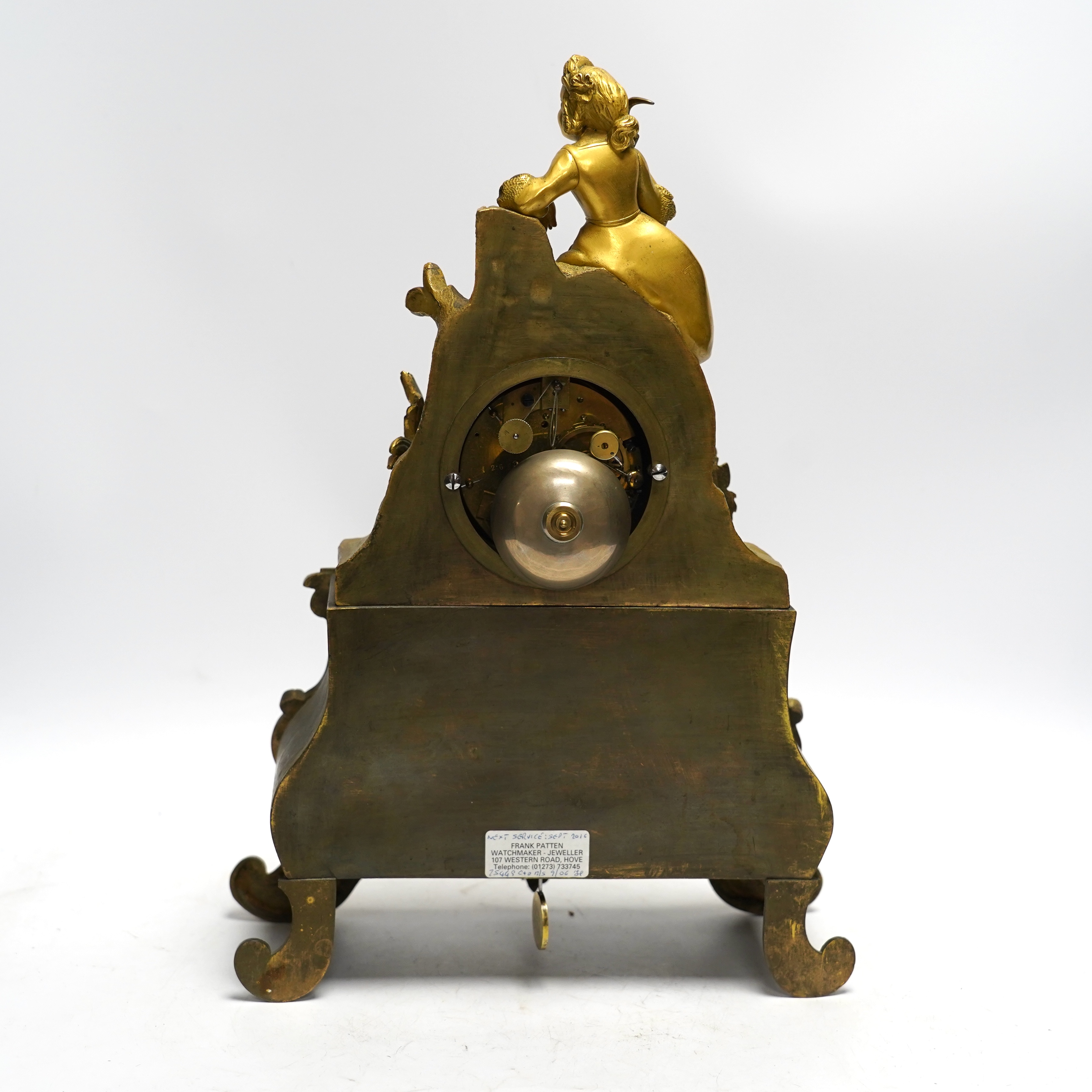 A mid 19th century French ormolu figural mounted clock with silk suspension, with key, 36cm